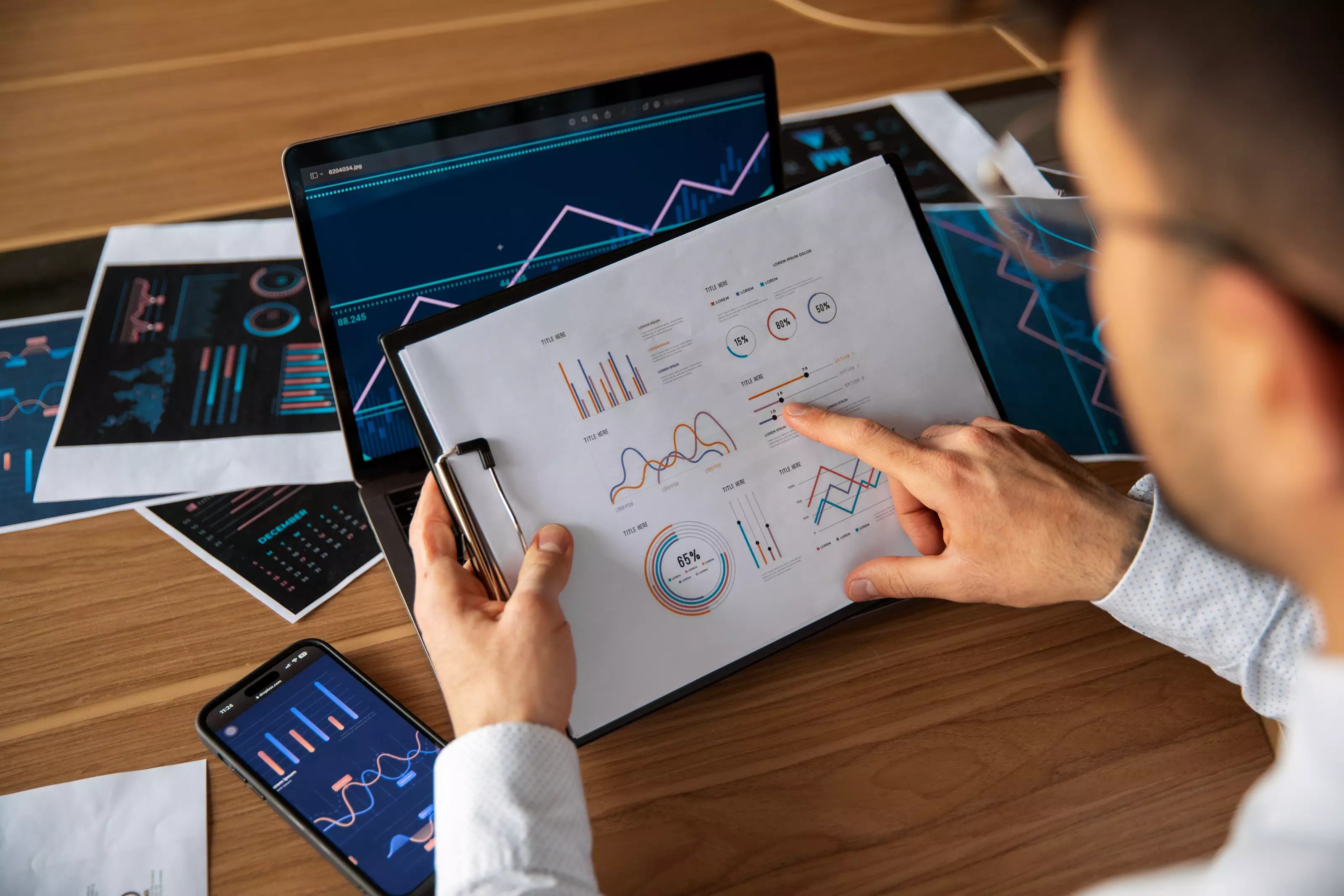 office-workers-using-finance-graphs_105