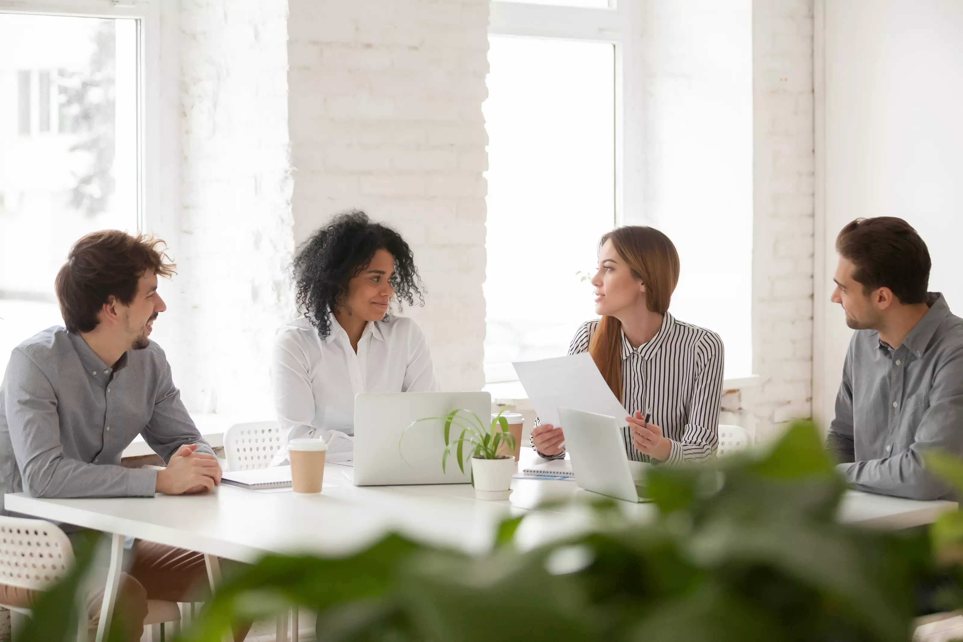 multiracial-male-female-colleagues-having-discussion-team-meeting_190